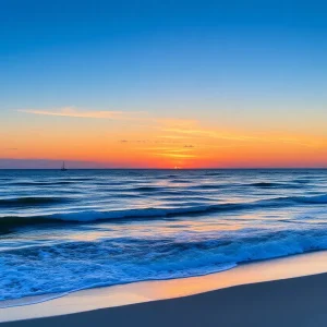 Sunset over the ocean at Kill Devil Hills with fishing boats