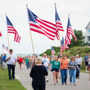 Participants of the 9/11 memorial walk in Kill Devil Hills with American flags