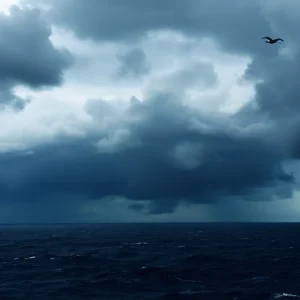 A storm forming at sea with dark, swirling clouds and rough ocean waves.