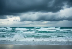 A stormy beach scene during Tropical Storm Imelda with dark skies and rough waves.